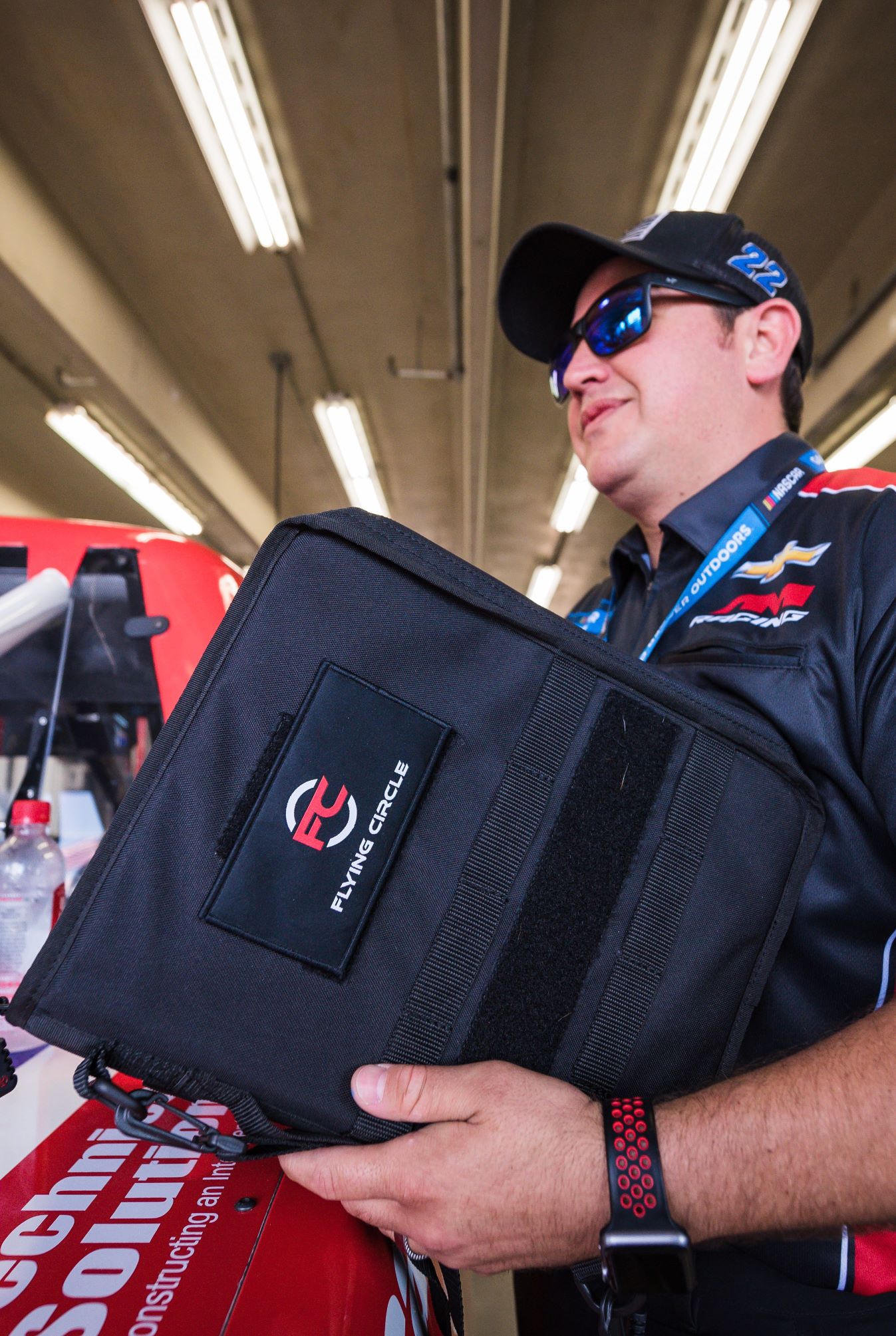 Man holding black Tactical Padfolio.